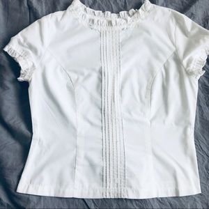 Delicate white top with neckline detail